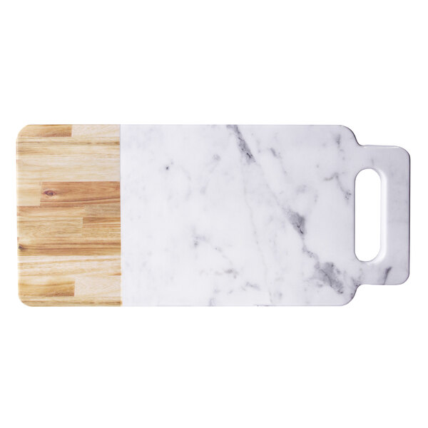 A white marble and faux alder wood serving board with a handle.
