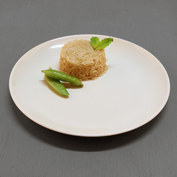 An Elite Global Solutions Karma melamine plate with rice and a green bean on it.