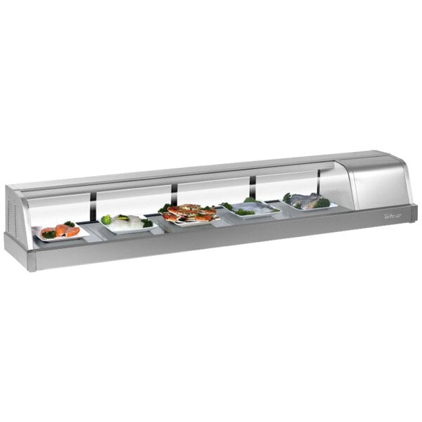 A Turbo Air stainless steel curved glass refrigerated sushi case with different types of food on display.