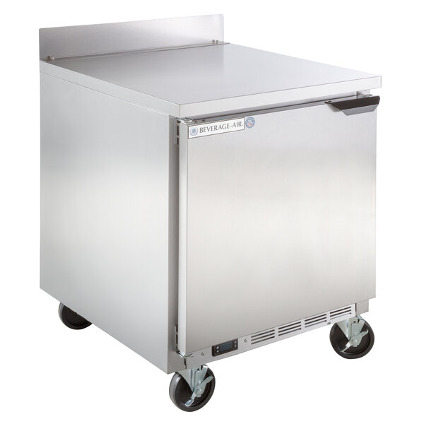 A large silver stainless steel Beverage-Air worktop freezer with wheels.
