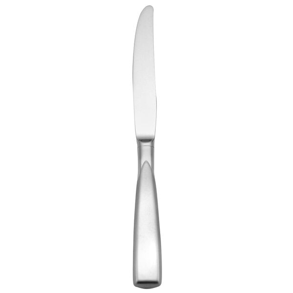A silver knife with a hollow handle.