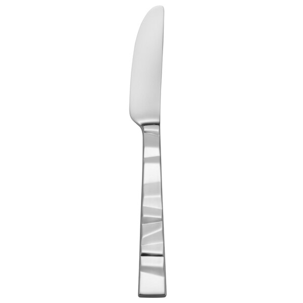 A white rectangular object with a silver handle and a white blade.
