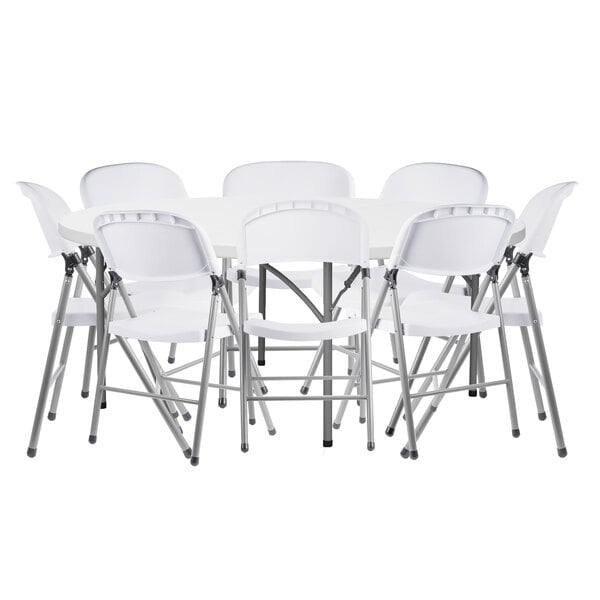 A Lancaster Table & Seating white plastic folding table with white folding chairs stacked on top.