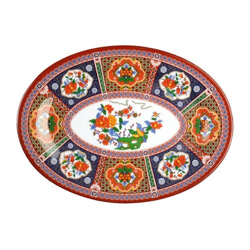 A close-up of a Thunder Group oval melamine platter with a peacock design.
