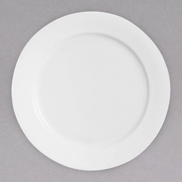 A Chef & Sommelier white bone china service plate with a white rim.