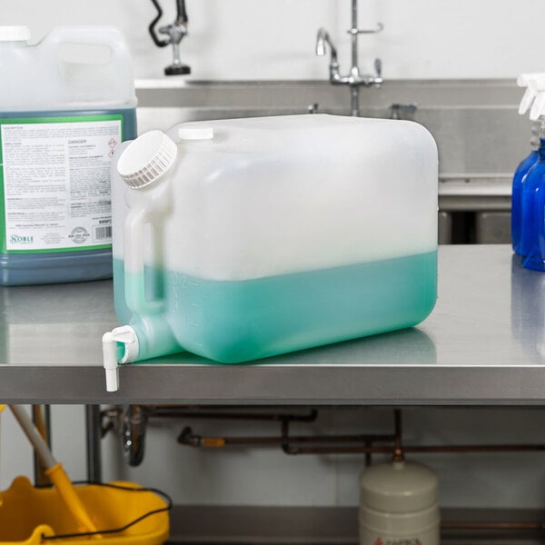 A plastic jug of blue liquid on a table.