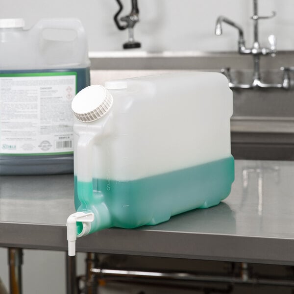 A plastic jug of green liquid on a counter.