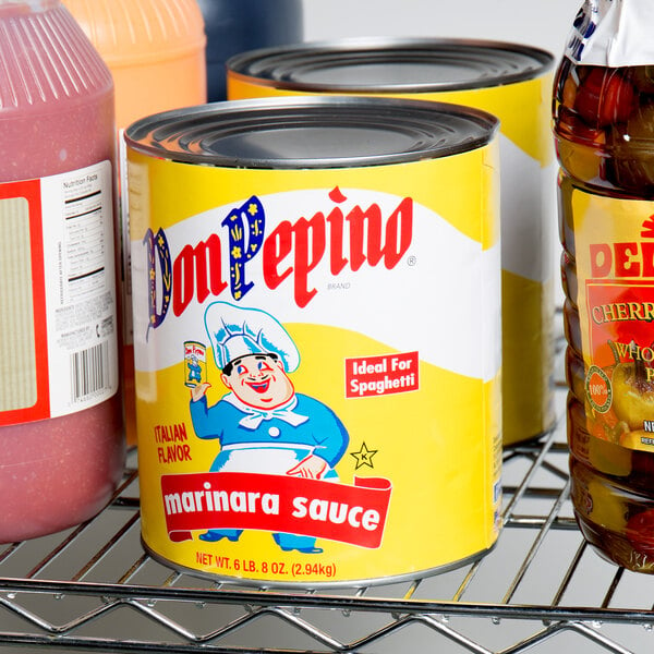A Don Pepino #10 can of marinara sauce on a shelf with other canned goods.