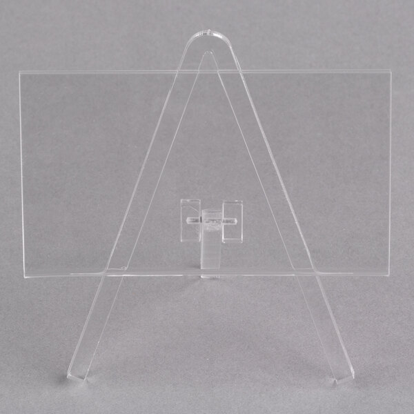 A clear plastic Tablecraft easel with a cross on it.