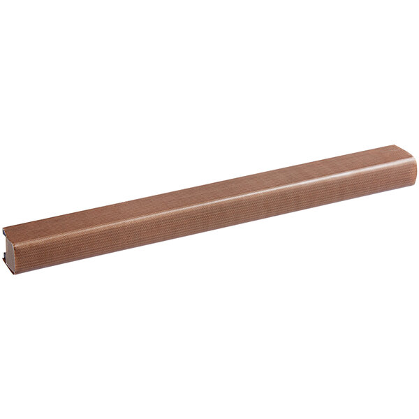 A brown rectangular object with a long brown wooden handle.