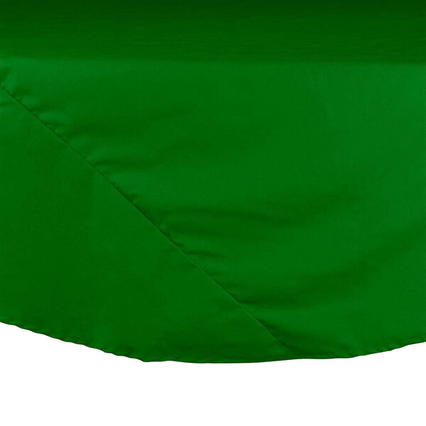 An Intedge green poly/cotton blend round table cover.
