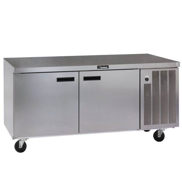 A Delfield stainless steel undercounter refrigerator with two doors and two drawers.