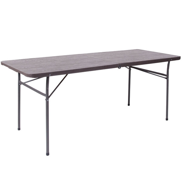 A Flash Furniture rectangular brown wood grain plastic folding table with metal legs.