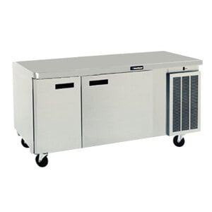 A stainless steel Delfield undercounter refrigerator with drawers and doors on wheels.