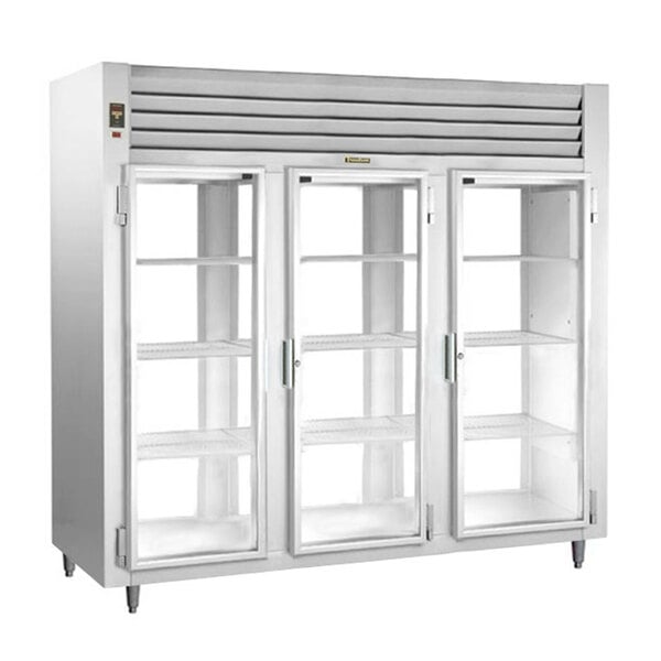 A Traulsen narrow pass-through refrigerator with three glass doors and white shelves.