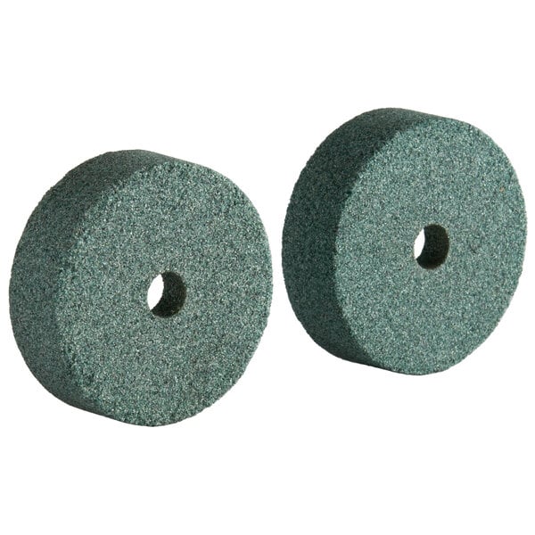 Two green Avantco coarse sharpening stones.