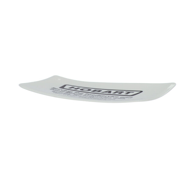 A white rectangular bowl scraper with black text on it.