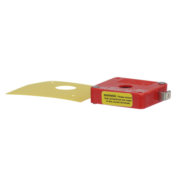 A red box with a yellow label for a Hobart 00-087711-154-1 Interlock Switch.