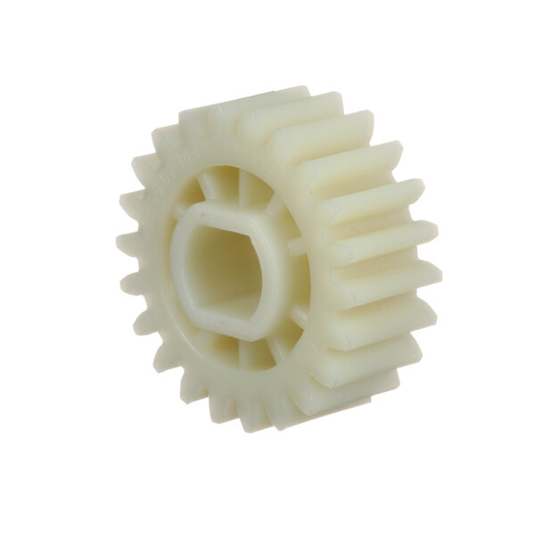 A close-up of a white plastic gear with a hole.