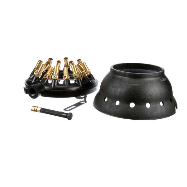 A black metal Town Volcano rice pot with brass fittings on a table.