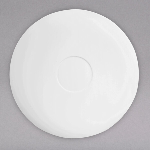 A white saucer with a circular rim.