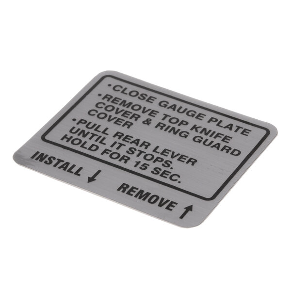 A metal plate with the words "close plate" on it.
