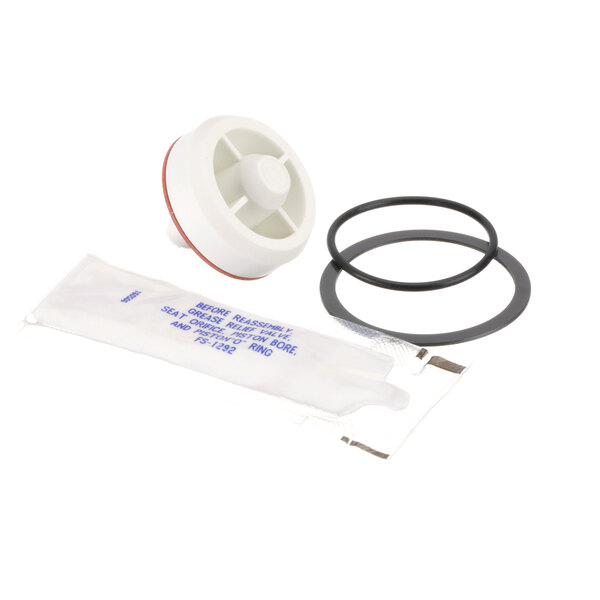 A white plastic bag with a white water pump repair kit with black and red rubber parts inside.