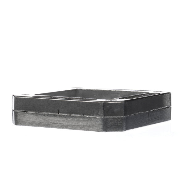 A black rectangular metal cutting head with a square design and holes.