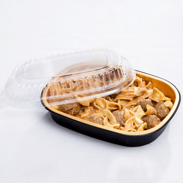 A Durable Packaging black and gold aluminum foil pan with food inside and a dome lid.