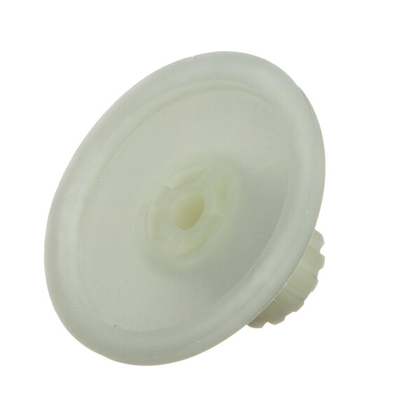 A white plastic drive gear with a hole in the center.
