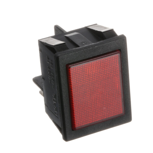 A close-up of a red square Quality Espresso pilot light.