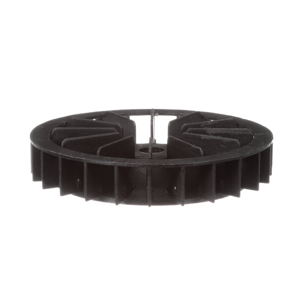 A black plastic wheel with holes.