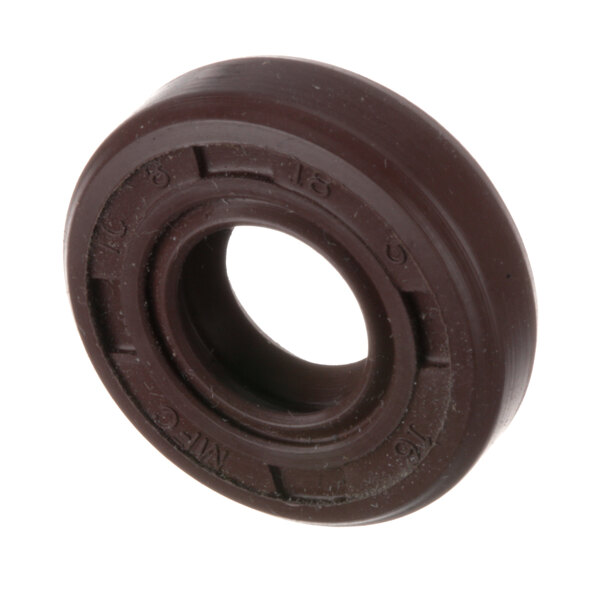 A close-up of a brown circular rubber seal with a hole in the center.