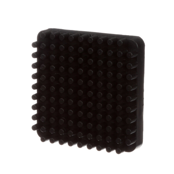 A black square Shaver pusher block with small black dots.