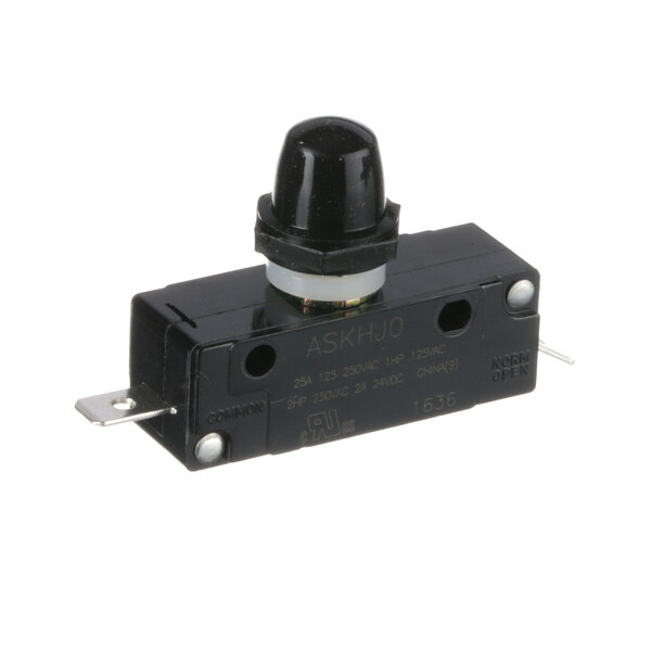 A close-up of a black plastic Follett Corporation switch