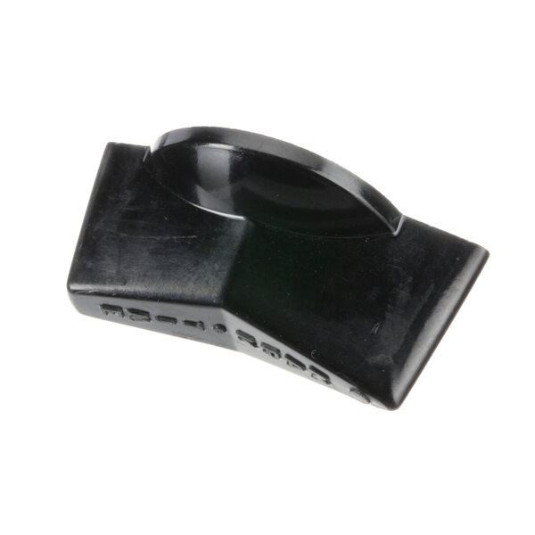 A black plastic timer knob with a curved edge and a hole in it.