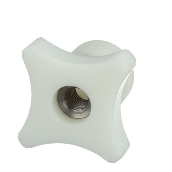 A white plastic star with a metal nut on the back.