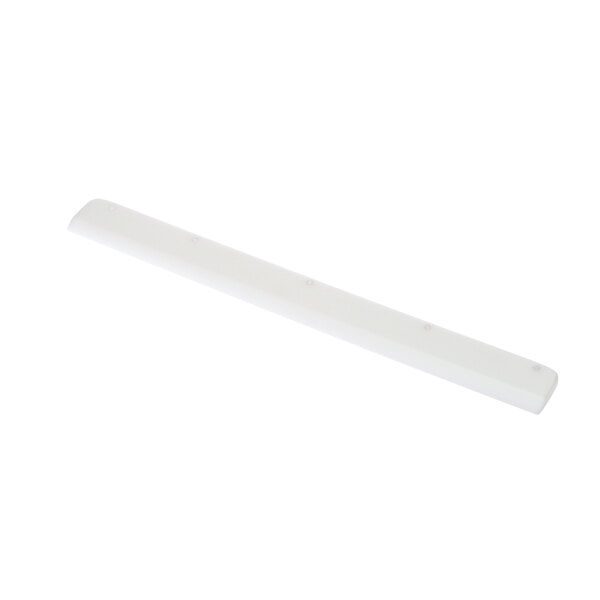A white rectangular plastic scrapper with holes on the end.