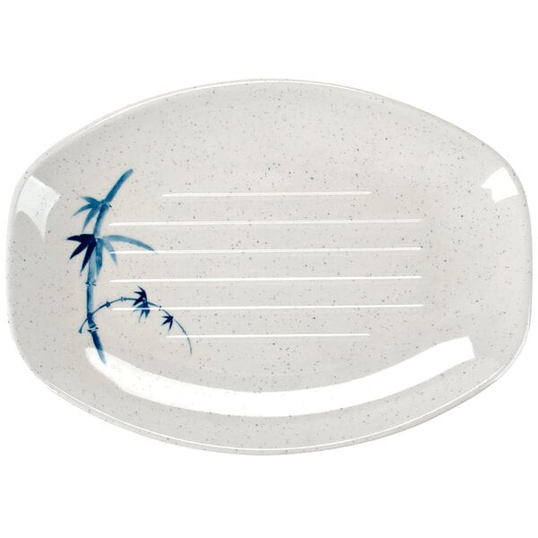 A white oval melamine tray with blue and white bamboo design.