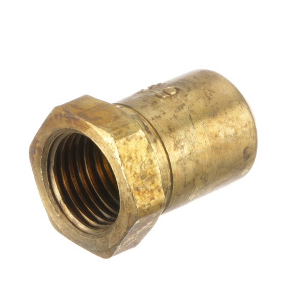 A close-up of a brass threaded nut with a hole.