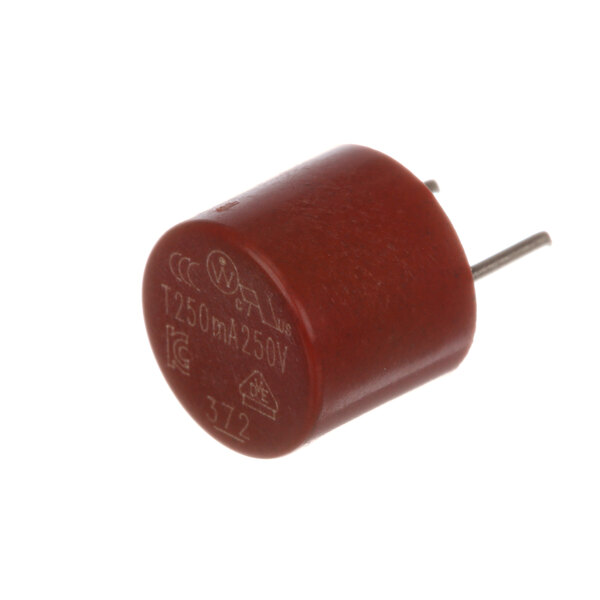 A close-up of a red electrical component with a metal cap and pin.