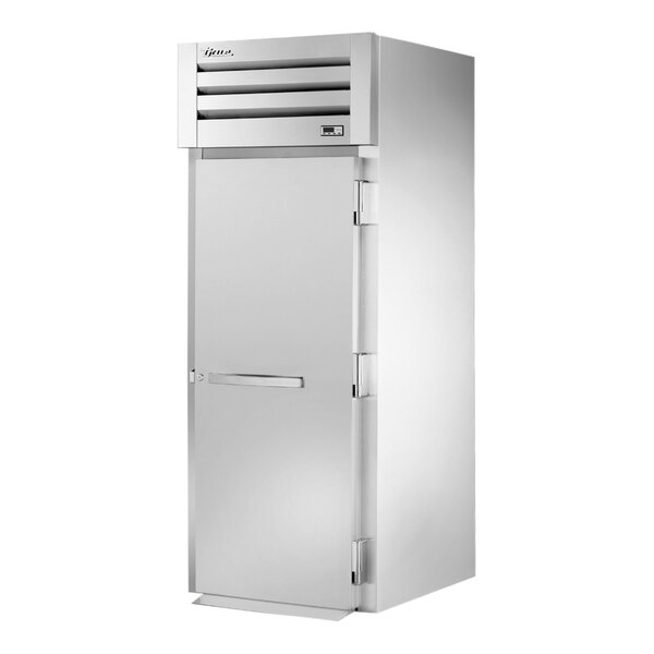 A stainless steel True Spec Series roll-in refrigerator with a solid door and silver handle.