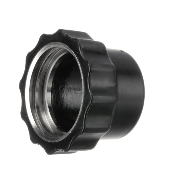 A black plastic pipe fitting with a metal cap and nut.
