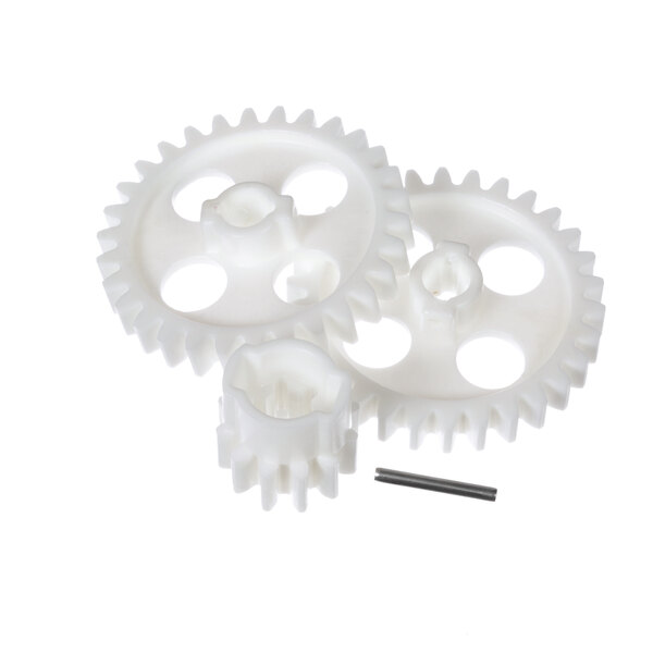 A close-up of two white plastic gears with a pinion.