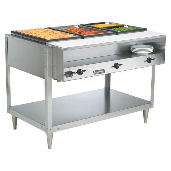 A Vollrath ServeWell electric hot food table with three sealed wells holding food trays.