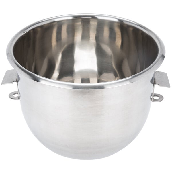 A silver Vollrath mixing bowl with two handles.