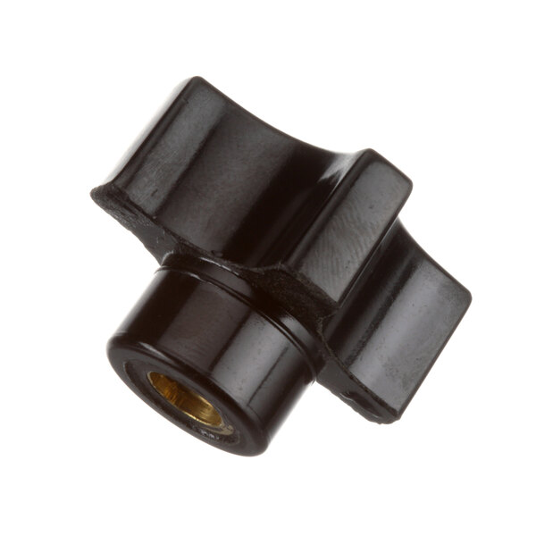 A black plastic knob with a gold center on the Oliver bread slicer.