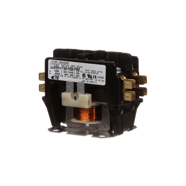 A close-up of a black and gold Grindmaster-Cecilware contactor with a small switch.