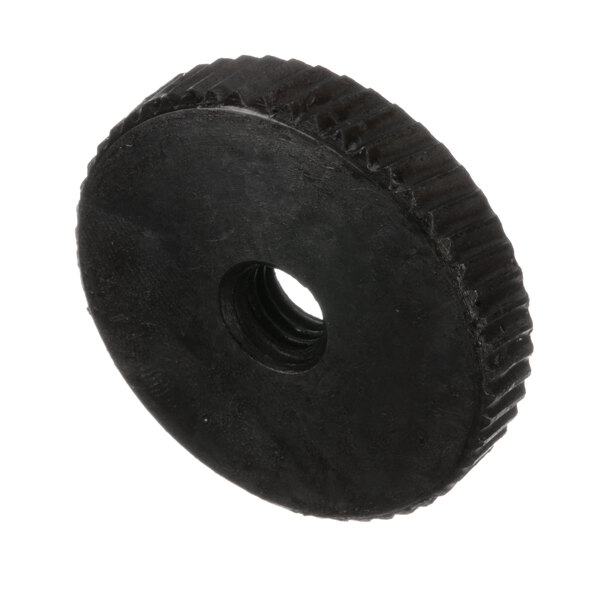 A black plastic round nut with a hole in it.