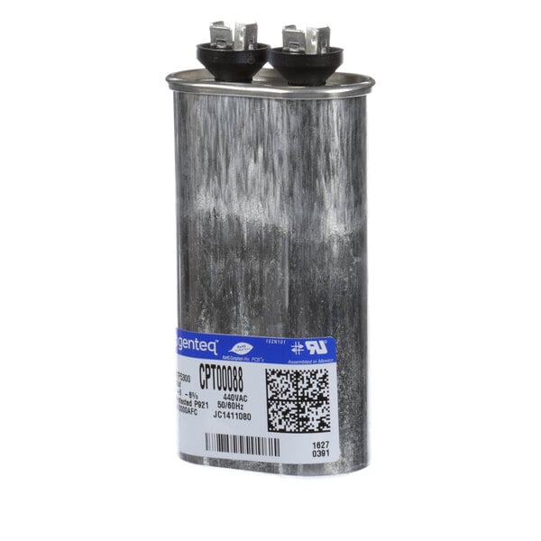 A Trane oval metal capacitor with black caps and a label.